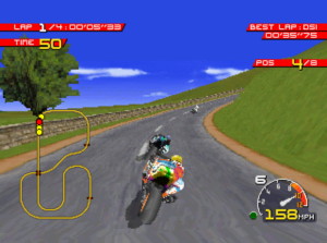 Motorcycles racing along a curved, grass hilly with a tree on the side of the road. This is a screenshot from the game Moto Racer.