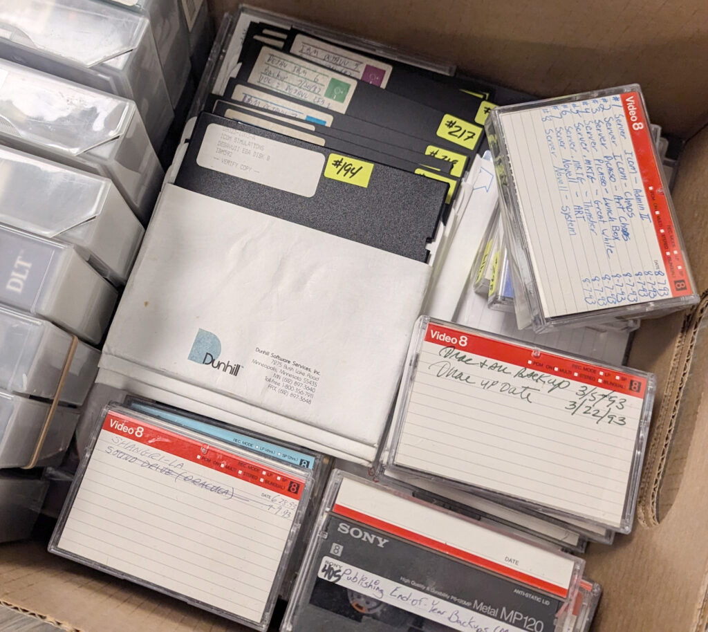 A pile of disks and data tapes, some marked "Deja Vu" and "Dracula."