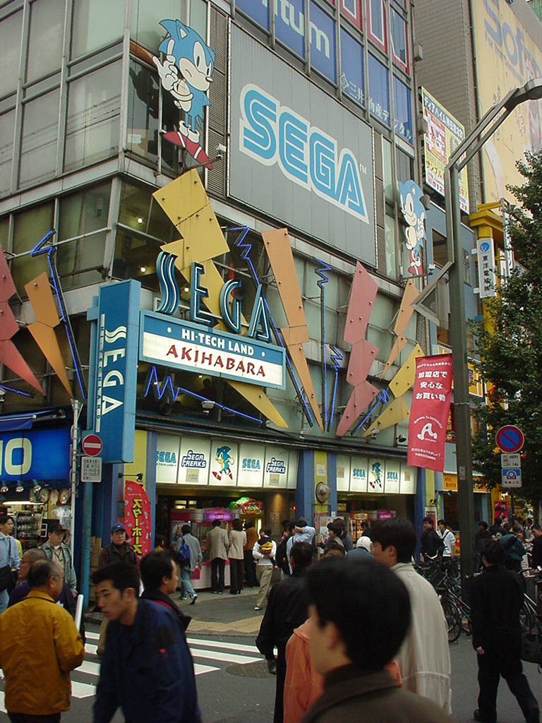 The exterior of Sega Hi-Tech Land Akihabara, a multi-floor building covered in pictures of Sonic the Hedgehog.
